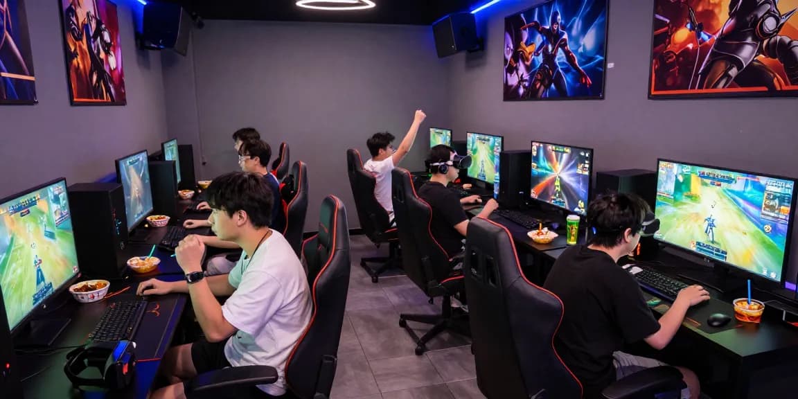 Exciting hit club gaming lounge with players immersed in competitive gameplay.